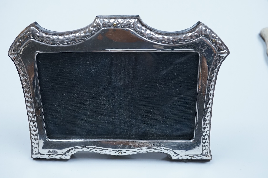 An Elizabeth II silver baluster christening mug, Wakely & Wheeler, London, 1965, with engraved inscription to the base, 10cm, together with two modern silver mounted photograph frames including a double and one other met